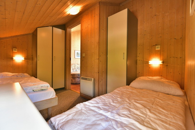 Ferienhaus in Pelzerhaken - Ferienhaus Typ C im Ferienpark AM WALDRAND - Schlafzimmer mit Einzelbetten