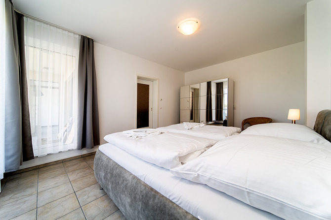 Ferienwohnung in B&ouml;rgerende - Appartement 1 - Familiensuite - Schlafzimmer 2 mit TV